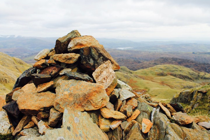 Stone cairn on top of Birk Fell in Lake District National Park