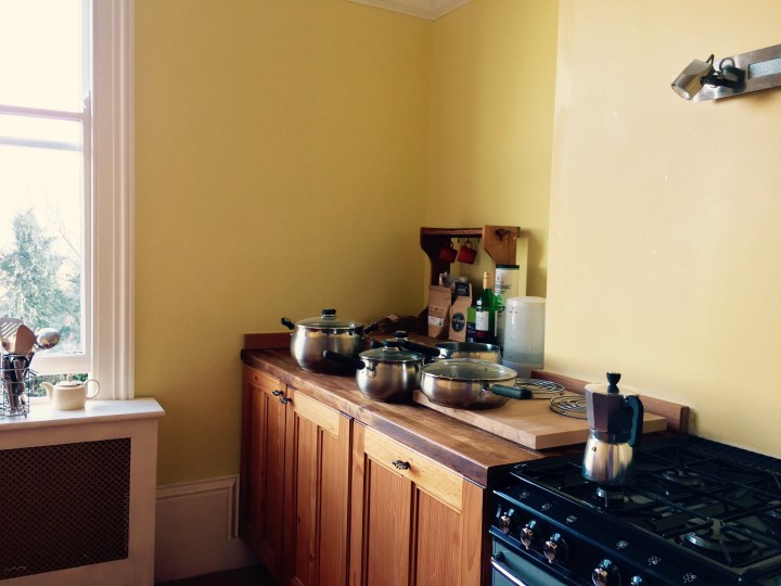 Yellow kitchen with range cooker
