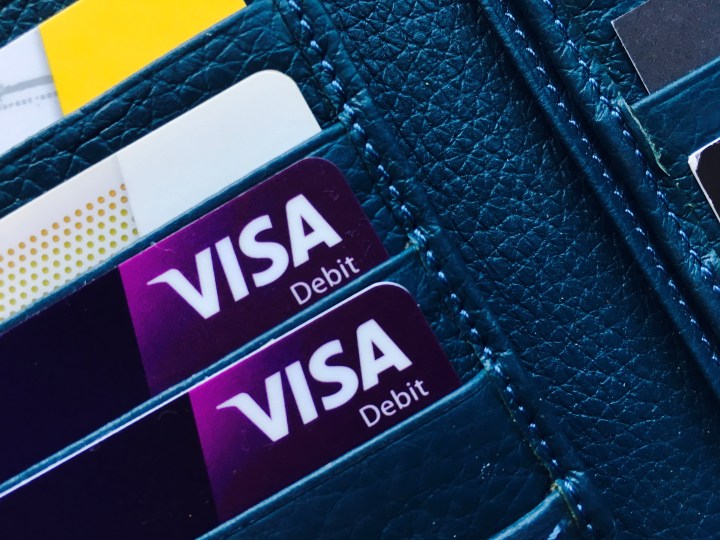 Bank cards sitting in a ladies wallet.