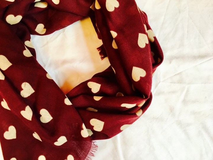 Burgundy merino scarf with cream heart pattern.