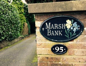 'Marsh Bank' name plaque in front of English house