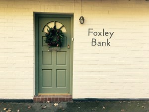 'Foxley Bank' name plaque on side of English house