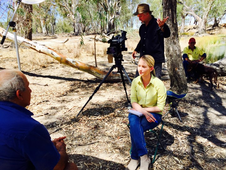 Australian journalist doing a television interview in the bush.