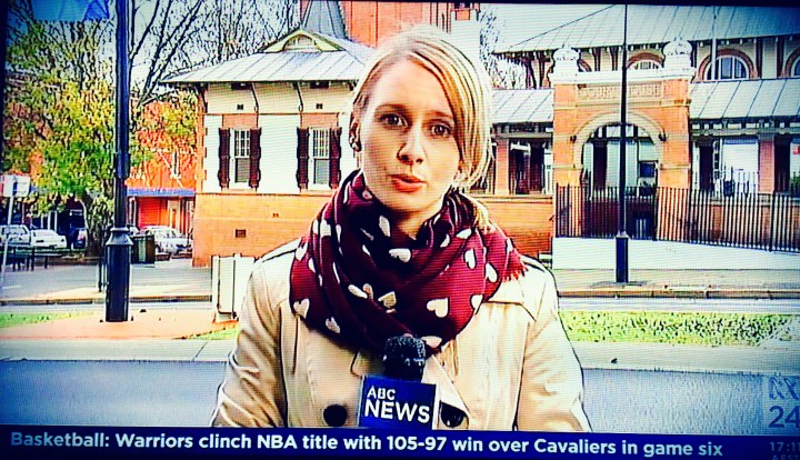Journalist doing a television cross.