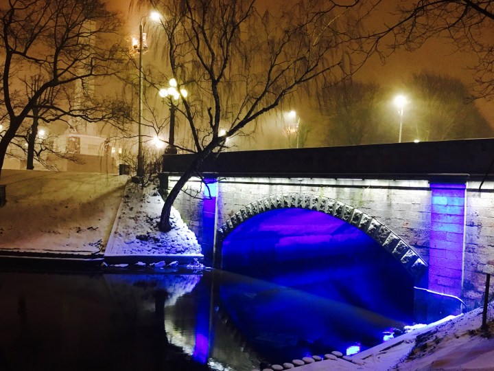 Snow falling in central Riga, Latvia at night.