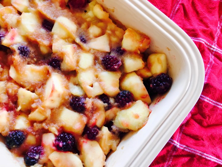 The filling of a blackberry and apple crumble.