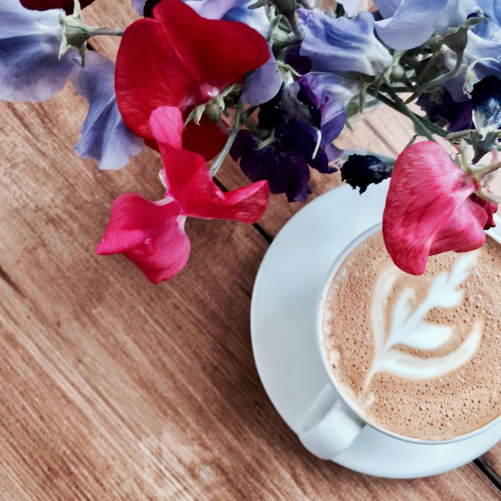 Coffee and sweet pea flowers