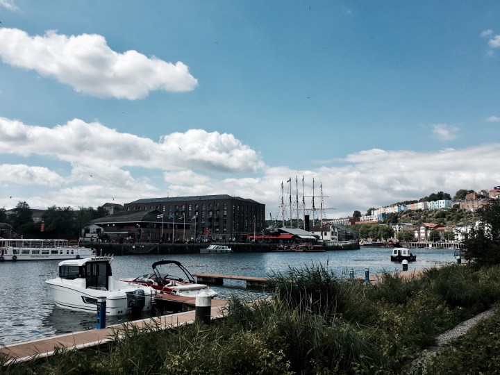 Boats and houses around the Bristol Harbourside.