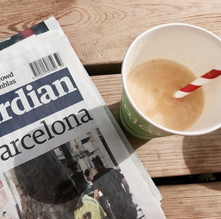 Guardian newspaper and a fruit smoothie.