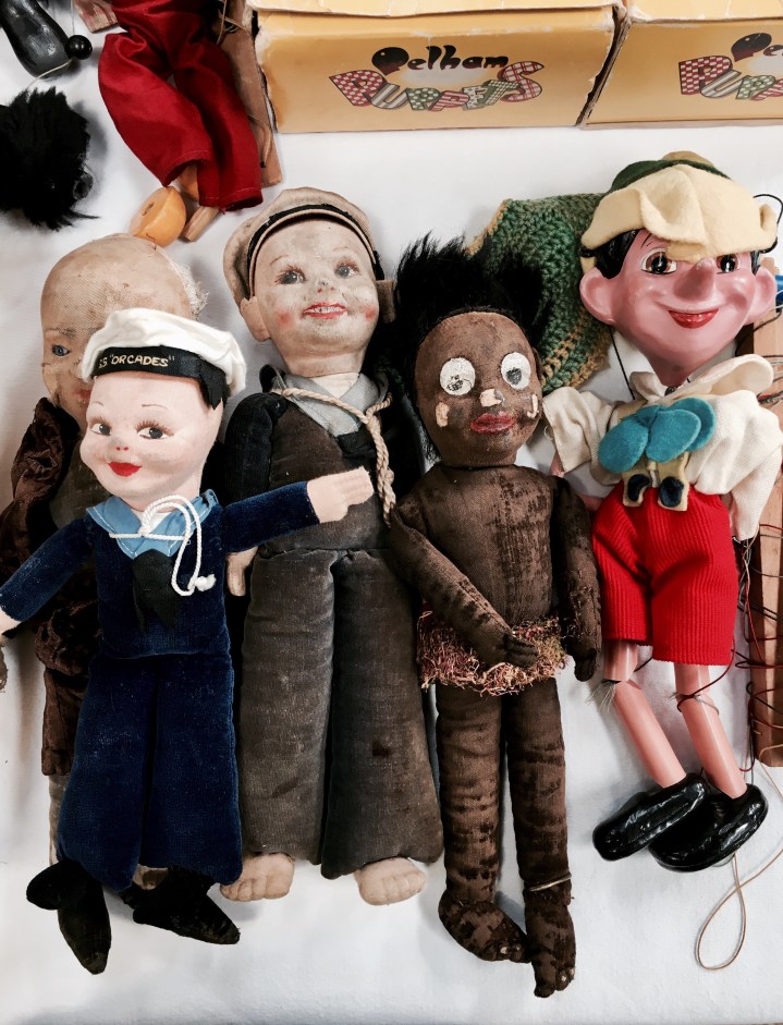 Old dolls and puppets for for sale at a flea fair in Malvern, Worcestershire, England.