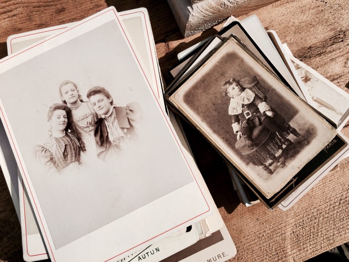 Piles of old pictures at a flea fair in Malvern, Worcestershire, England.