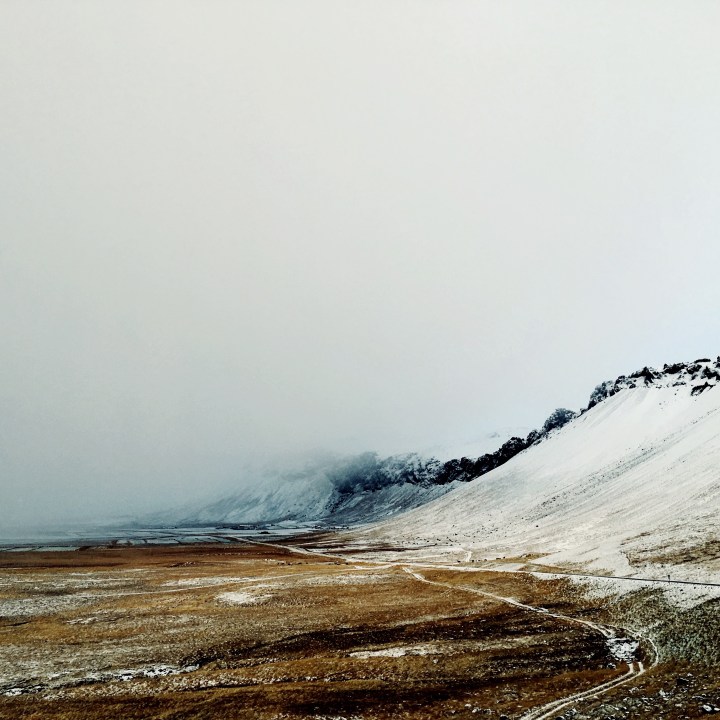 Snowstorm on the The northern lights on the Snæfellsnes Peninsula, Iceland.