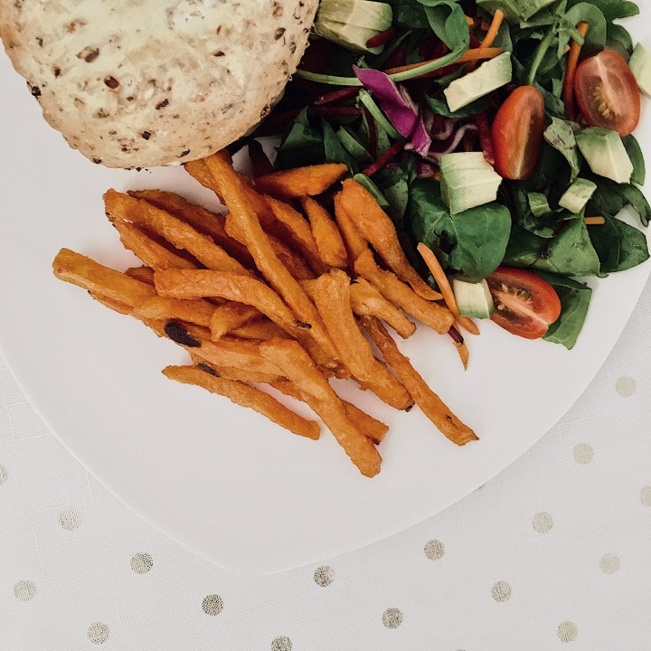 Home made burgers with sweet potato fries and a side salad.