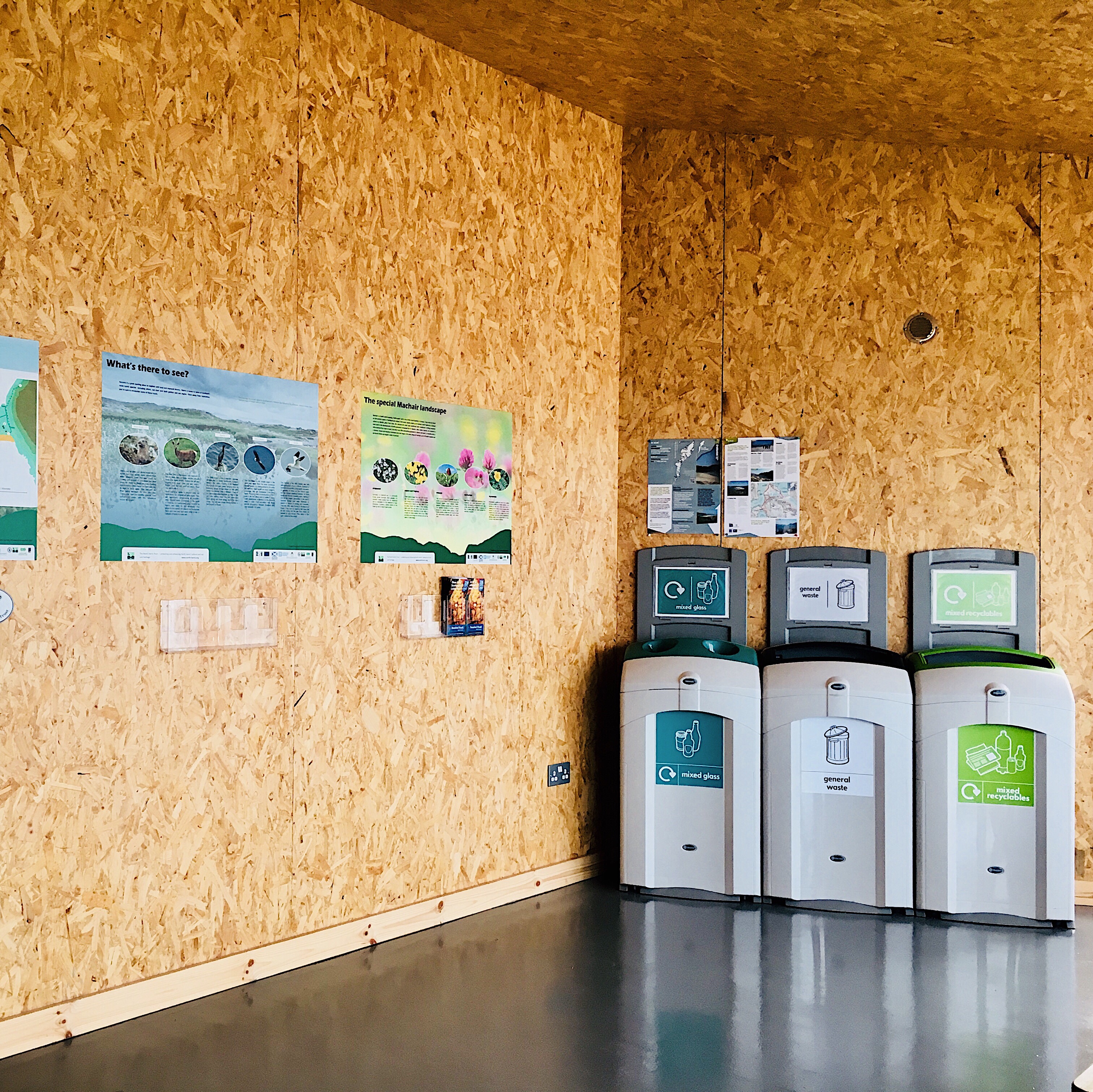 Recycling bins and visitor information at the Huisinis Gateway, Isle of Harris, Scotland.