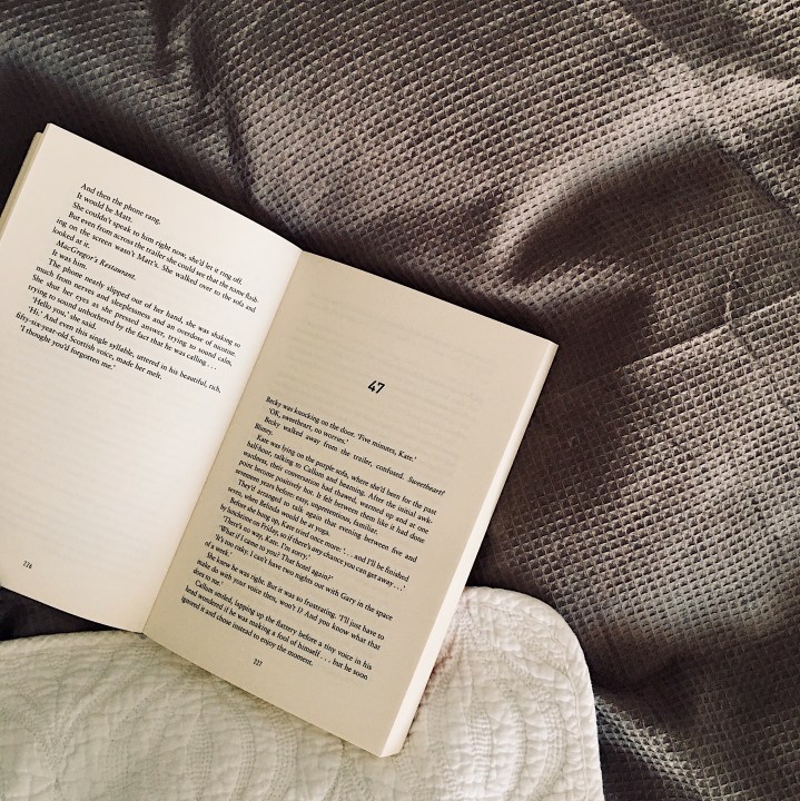 Open book on bed.