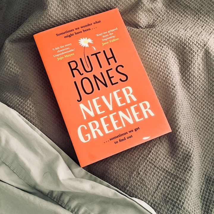 Ruth Jones' 'Never Greener' sitting on a bed.