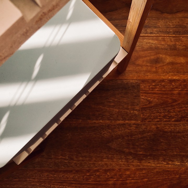 Light blue Country Road tin sitting on shelf.