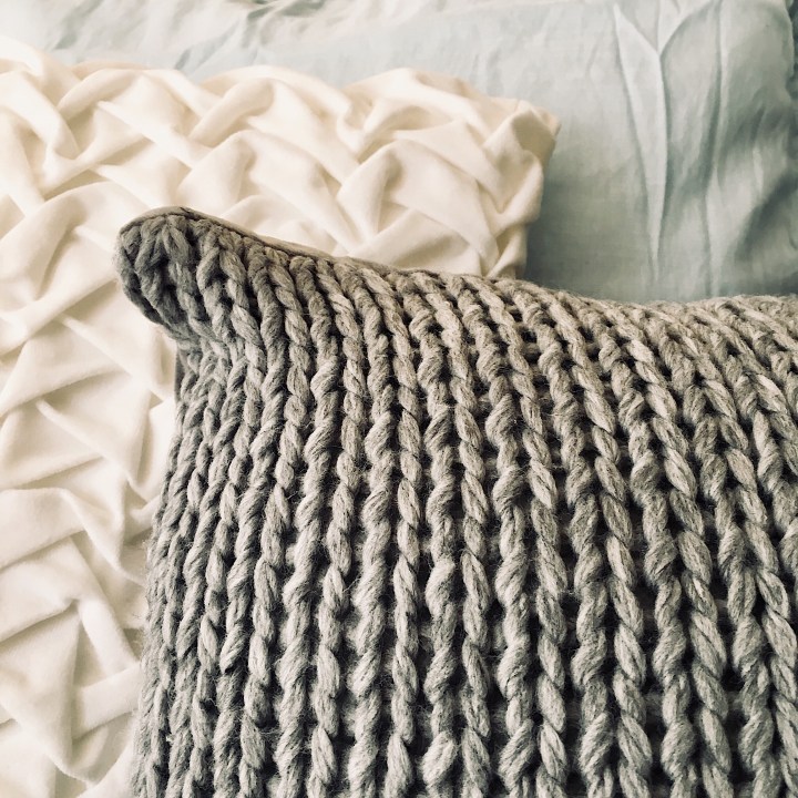 Kmart cushions in grey and white.