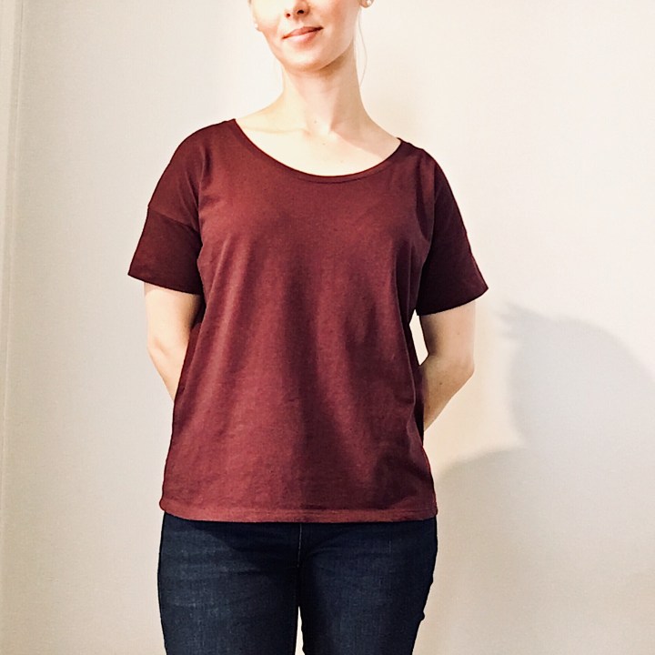 Woman wearing Everlane Box Tee in burgundy.