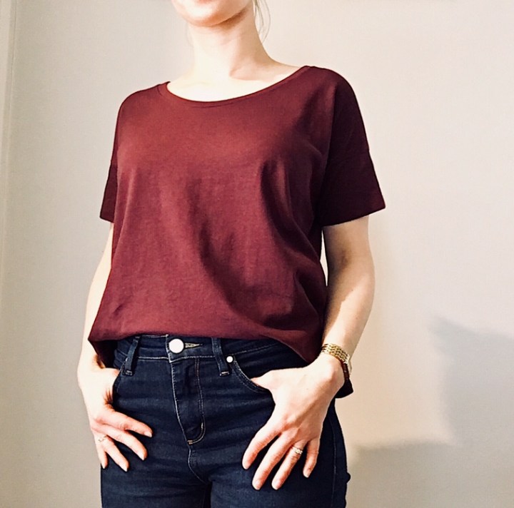 Woman wearing Everlane Box Tee in burgundy.