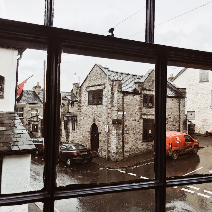 Looking out of a window onto a rainy Hay-on-Wye, Herefordshire, England.