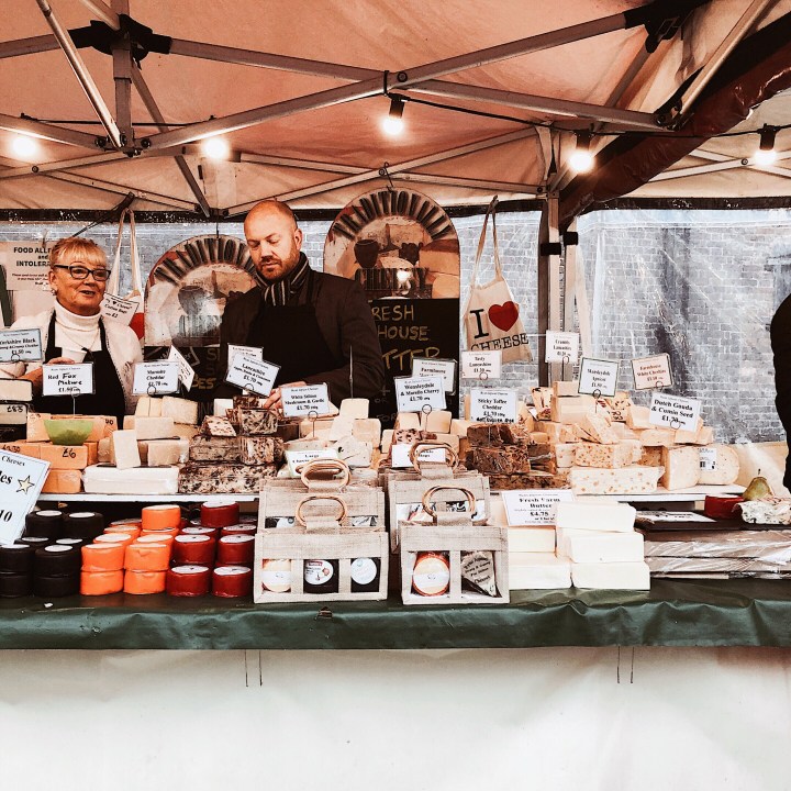 Stall selling cheese at the Worcester Christmas Fayre, England.