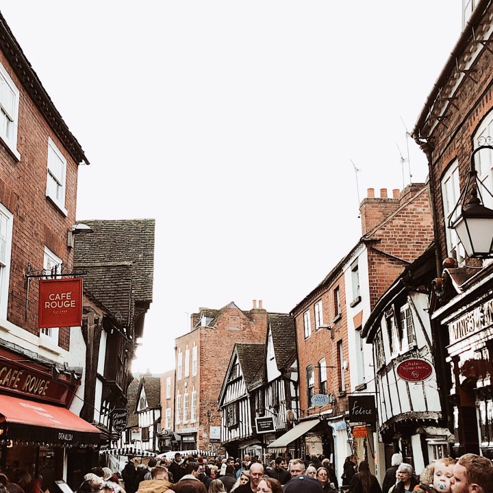 Shops and crowds at the Worcester Christmas Fayre, England.