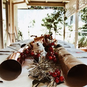 Table under verandah decorated for Christmas.