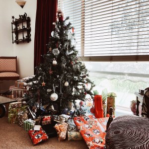 Small Christmas tree surrounded by presents.