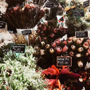 A flower seller at the Queen Victoria Market in Melbourne, Victoria, Australia.
