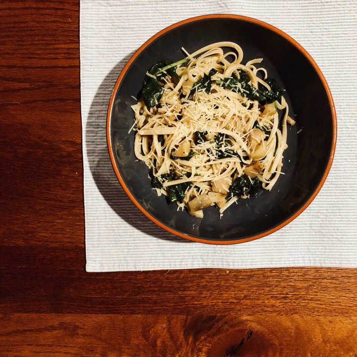Bowl of pasta melanzana on a table.