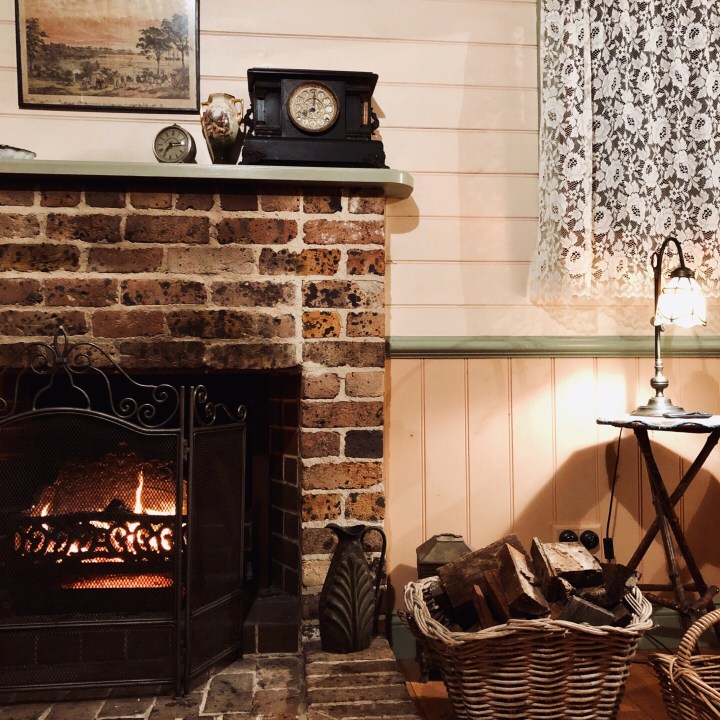 Fireplace in Settlers Cottage, Kangaroo Valley, New South Wales, Australia.