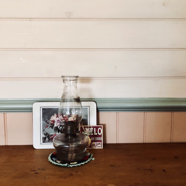 Paraffin lamp on wooden table.