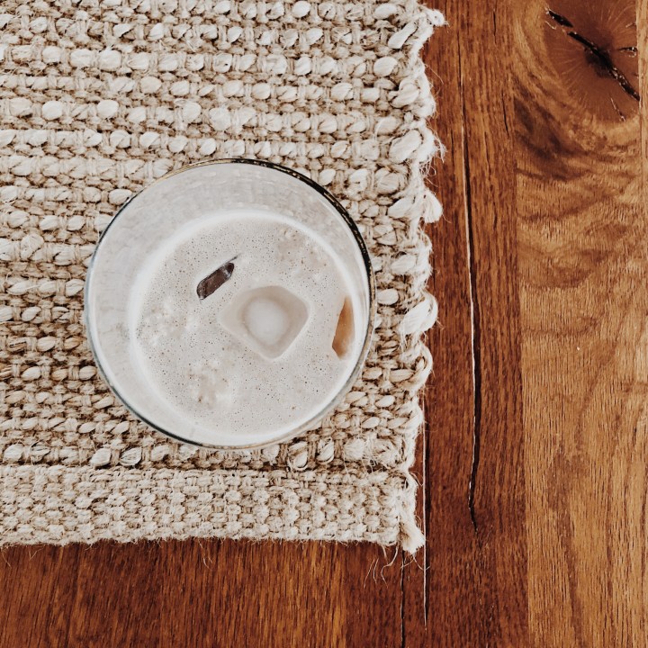 Looking down at a glass of fruit smoothie.
