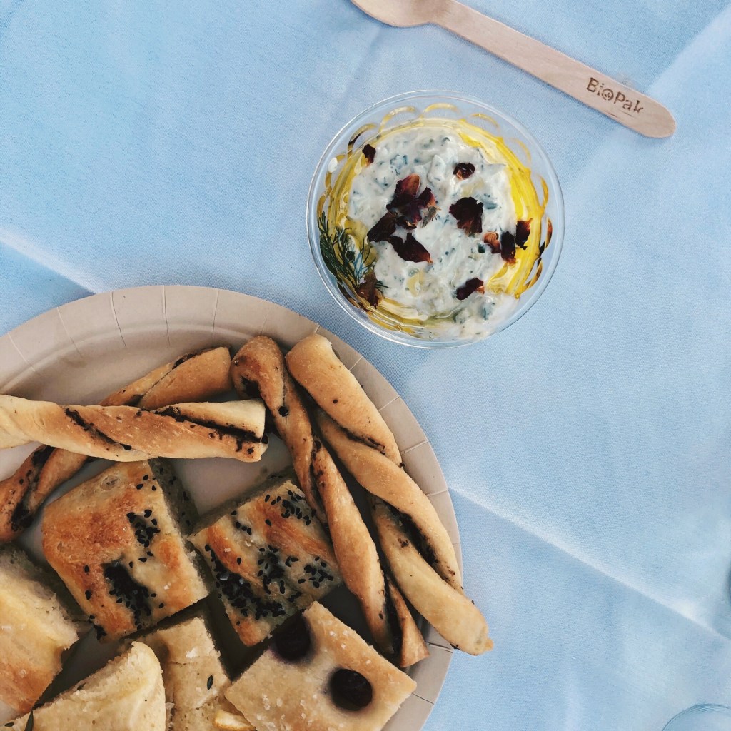 Looking down at homemade breads and dip.
