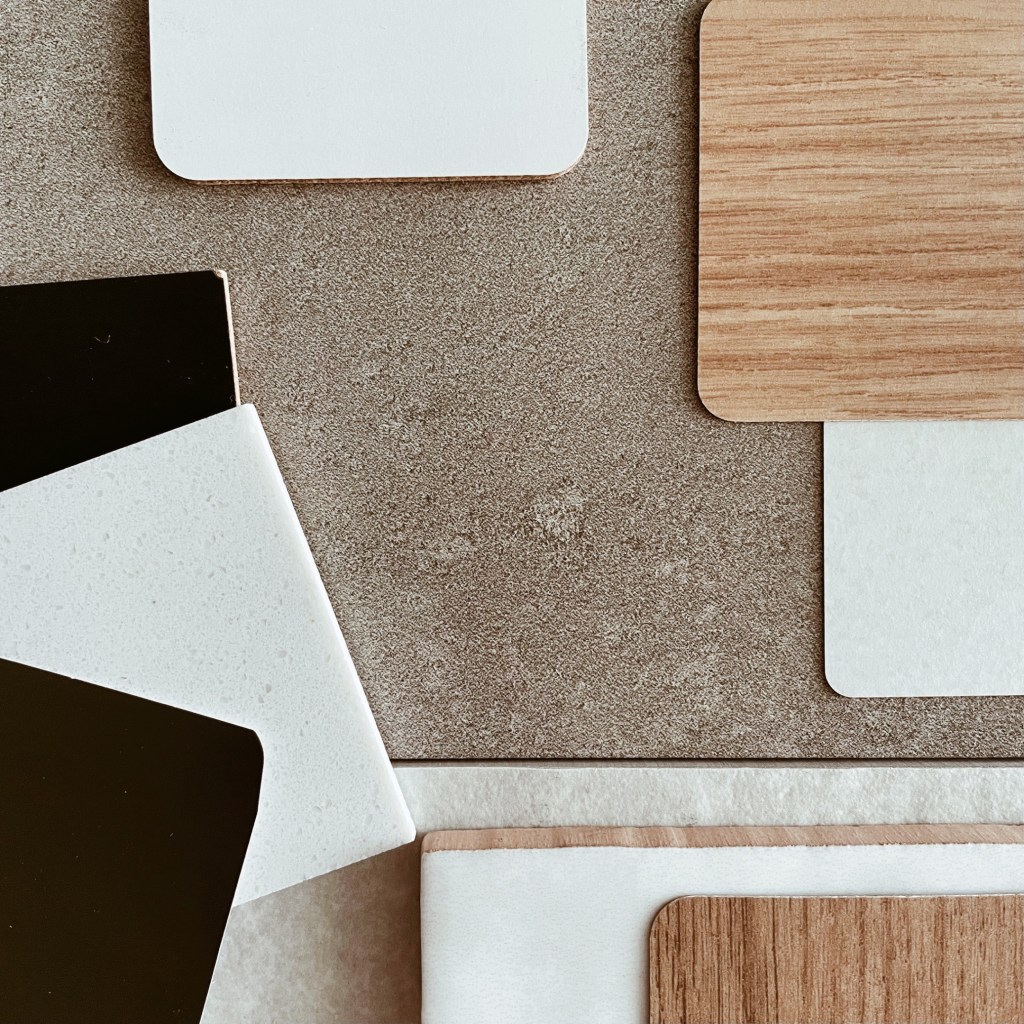 Looking down on tile, paint and laminate samples.